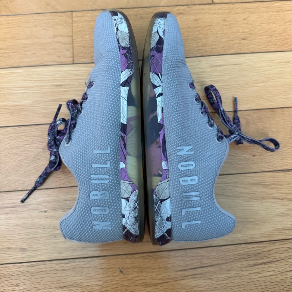 Nobull Arctic Magnolia Trainers in cement gray with a purple floral pattern